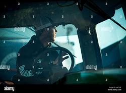 Image result for Farmer in a Tractor Cab