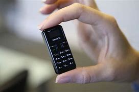 Image result for Mini Silver Flip Phone