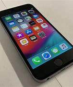 Image result for Verizon iPhone 6s Space Grey in Hand