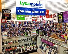 Image result for Man with Cell Phone in Record Store