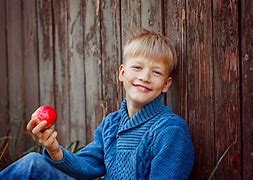 Image result for Boy Eating Apple Under Tree