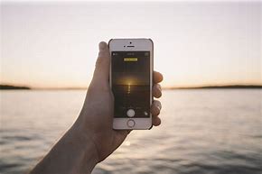 Image result for iPhone in Hand Aesthetic