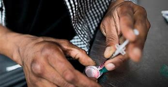 Image result for picture of a person injecting illegal drugs