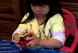 Image result for Lady Playign Rubik's Cube