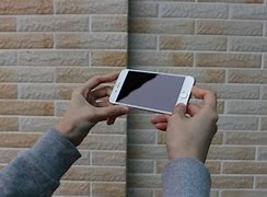 Image result for iPhone 6s in Hand Person