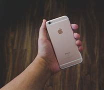Image result for Apple iPhone in Hand