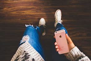 Image result for Someone Holding an iPhone 12