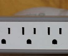 Image result for Wall Outlet Plug Holder