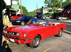 Image result for cherry red mustangs