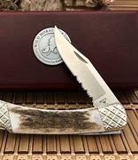 Image result for Serrated Hunting Knife