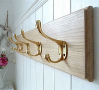 Image result for Chrome Coat Hooks Mounted On White Wood