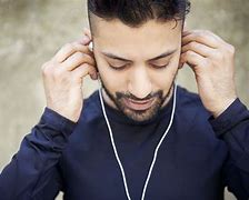 Image result for Person Wearing Earbuds