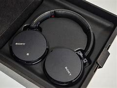 Image result for Sony Wireless Headphones with Stand Red