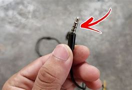 Image result for A Man Trying to Fix Headphone Jack