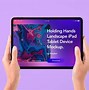 Image result for Holding Up iPad