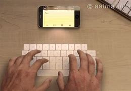 Image result for New iPhone Laser Keyboard