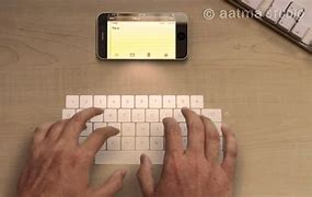 Image result for New iPhone Laser Keyboard