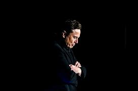 Image result for Images of Elon Musk Sitting Down