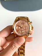 Image result for Brown Rose Gold Watch On Skin