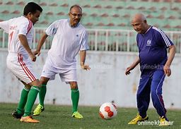 Image result for KP Oli Playing Football