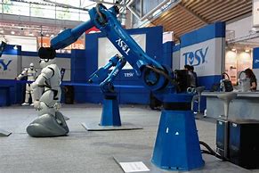 Image result for Robots Working in a Factory