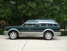 Image result for Forest Green GMC Typhoon