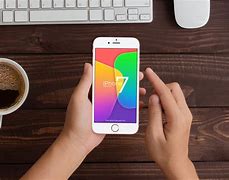 Image result for Hokding an iPhone Screen