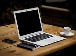 Image result for White Table with Mac and Phone
