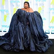Image result for Lizzo Black Dress and Flute