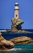 Image result for Tourlitis Lighthouse Off the Coast of Andros Island Greece Sunset