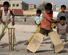 Image result for Photo of Kids Playing Paddock Cricket