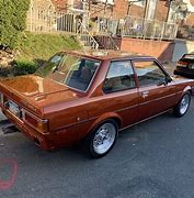 Image result for Old Red Toyota Corolla