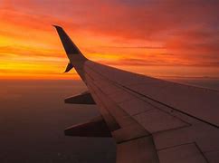 Image result for Airplane Wing in Sky