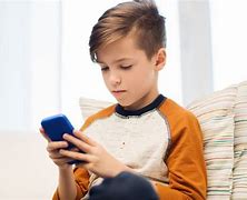 Image result for Boy Looking at Phone