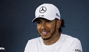 Image result for Lewis Hamilton in Green Cap
