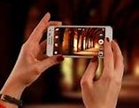 Image result for Holding iPhone for Picture