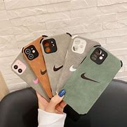 Image result for iPhone 11 Pro Max Nike Phone Case and Air Pods