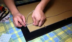Image result for Attaching Hanging Wire to Picture Frame