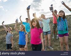 Image result for Kids Holding Apple iPhone SE