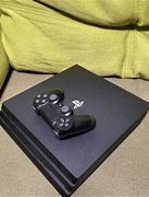 Image result for Sony PlayStation 4 Pro 1TB Gaming Console