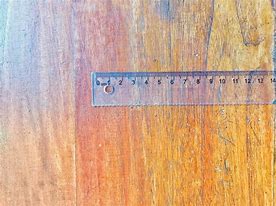 Image result for A Plastic Ruler On a Wooden Table