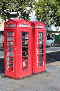 Image result for British Telephone Box with a Phone in It