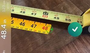 Image result for MagSafe Charger iPhone Next to a Ruler