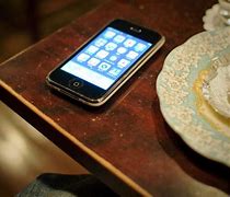 Image result for iPhone On Table Wallpaper