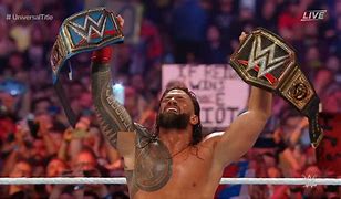 Image result for Roman Reigns Both Titles