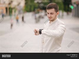 Image result for Man Looking at Watch without Face