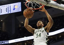 Image result for Giannis in a Stand Next to Fan