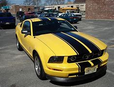 Image result for yellow mustang with black stripes