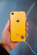 Image result for iPhone XR Hand Held Photo