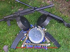 Image result for Shotgun with a Drum Cartridge